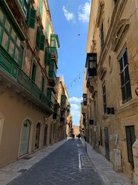 Narrow alley amidst residential buildings