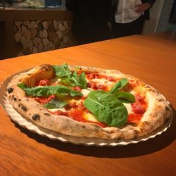 High angle view of pizza in plate on table