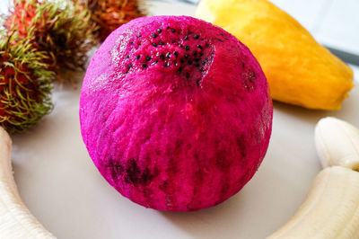 Close-up of pitaya with fruits in plate