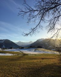 Calm lake with mountains in background