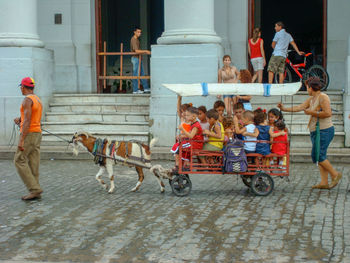 People enjoying on street in city