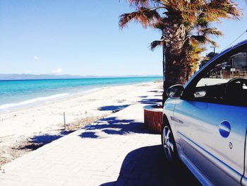 Scenic view of beach against blue sky