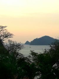 Scenic view of sea against clear sky during sunset