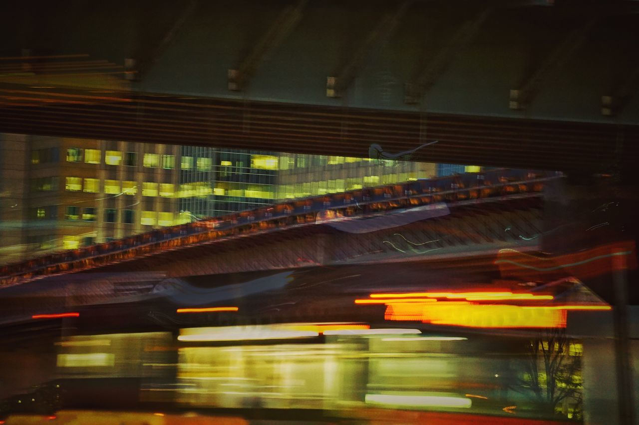 transportation, illuminated, indoors, night, built structure, public transportation, architecture, mode of transport, bridge - man made structure, motion, speed, travel, blurred motion, on the move, railroad station, connection, subway station, rail transportation, train - vehicle, lighting equipment