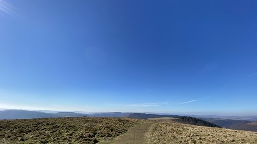 Scenic view of arid landscape against sky