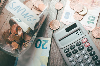 High angle view of coins on table