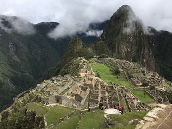 High angle view of townscape and mountains against sky