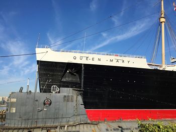 Low angle view of ship against blue sky