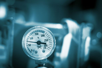 Close-up of pressure gauge in factory