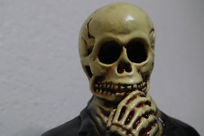 Close-up of human skull against black background