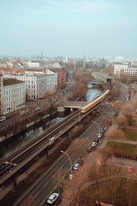 High angle view of railway bridge against sky in city