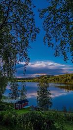 Scenic view of lake against cloudy sky