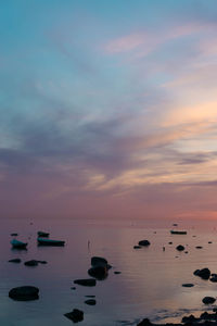 Scenic view of sea against sky at sunset