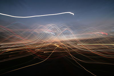 Light trails against sky at night