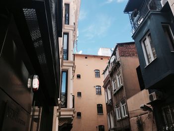 Low angle view of buildings in city against sky