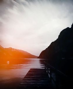 Scenic view of river against sky during sunset