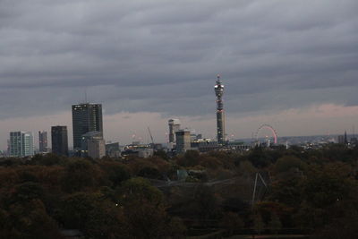 View of cityscape against dramatic sky