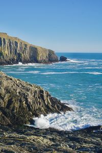 Scenic view of sea against clear blue sky