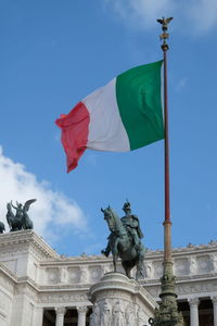 Low angle view of statues against sky