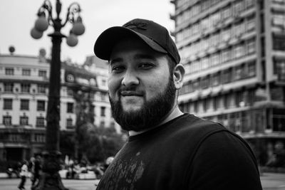 Portrait of smiling man in city