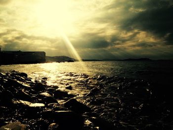 Scenic view of sea against cloudy sky