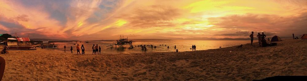 Scenic view of beach against sky during sunset