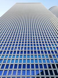 Low angle view of office building against sky