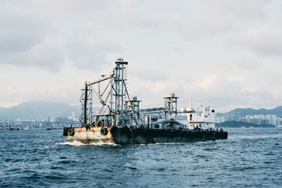 Ship in sea against sky