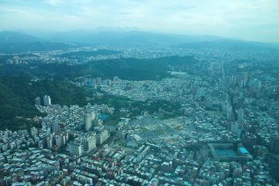 High angle view of city buildings against sky