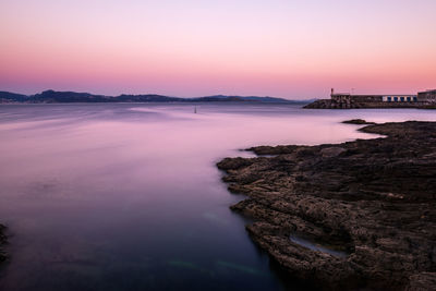 Scenic view of sea against clear sky during sunset