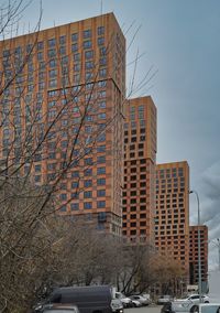 Low angle view of building against sky during winter