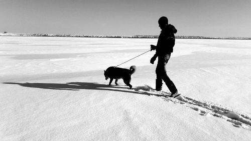 Man with dog walking outdoors