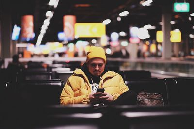 Man using mobile phone at night