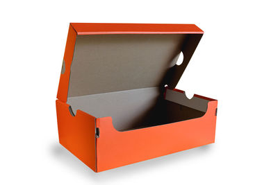 Low angle view of orange box against white background