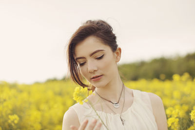 Close-up of young woman looking away