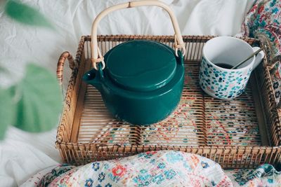 High angle view of wicker basket on bed at home