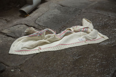 High angle view of shoes on footpath