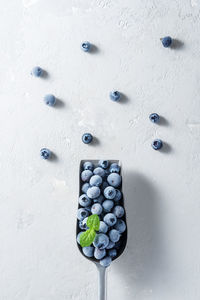 High angle view of candies against white background