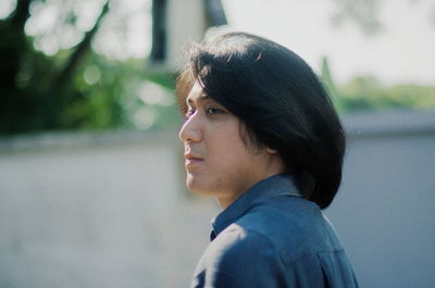 Side view of young man looking away