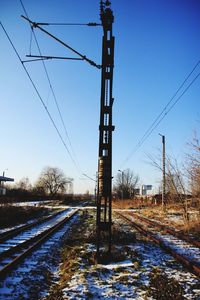 Electricity pylon against clear sky