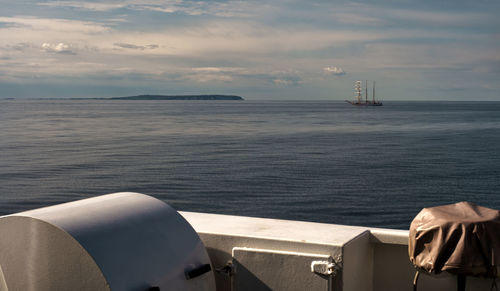 Boat sailing in sea against sky