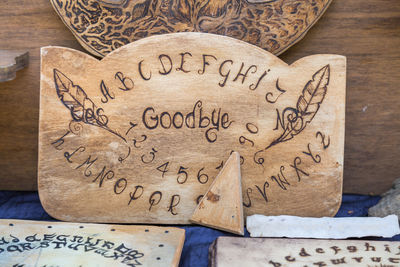 Close-up of text written on wood