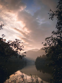 Scenic view of lake against sky during sunset