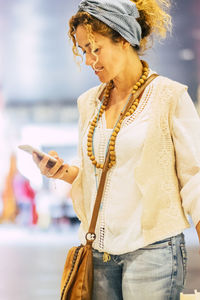 Young woman using mobile phone