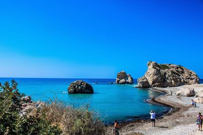 Scenic view of sea against clear blue sky