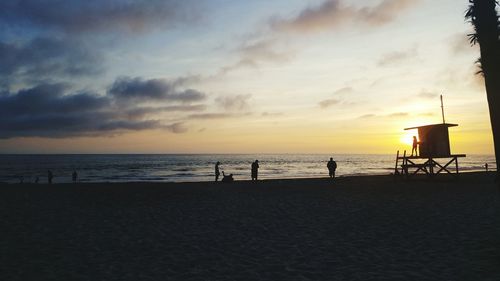 Scenic view of beach against sky during sunset