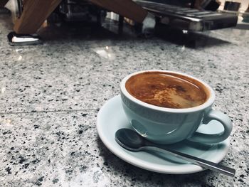 Close-up of coffee cup on table