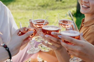 Midsection of woman holding drink