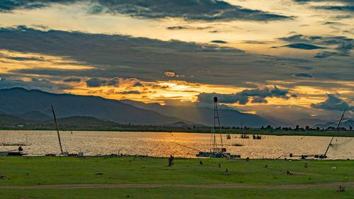 Scenic view of field against sky during sunset