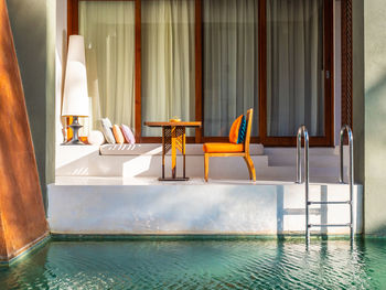 Chairs and tables in swimming pool